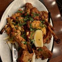 Lamb Chops · Succulent pieces of lamb chops marinated in spices, then broiled on skewers over charcoal in...