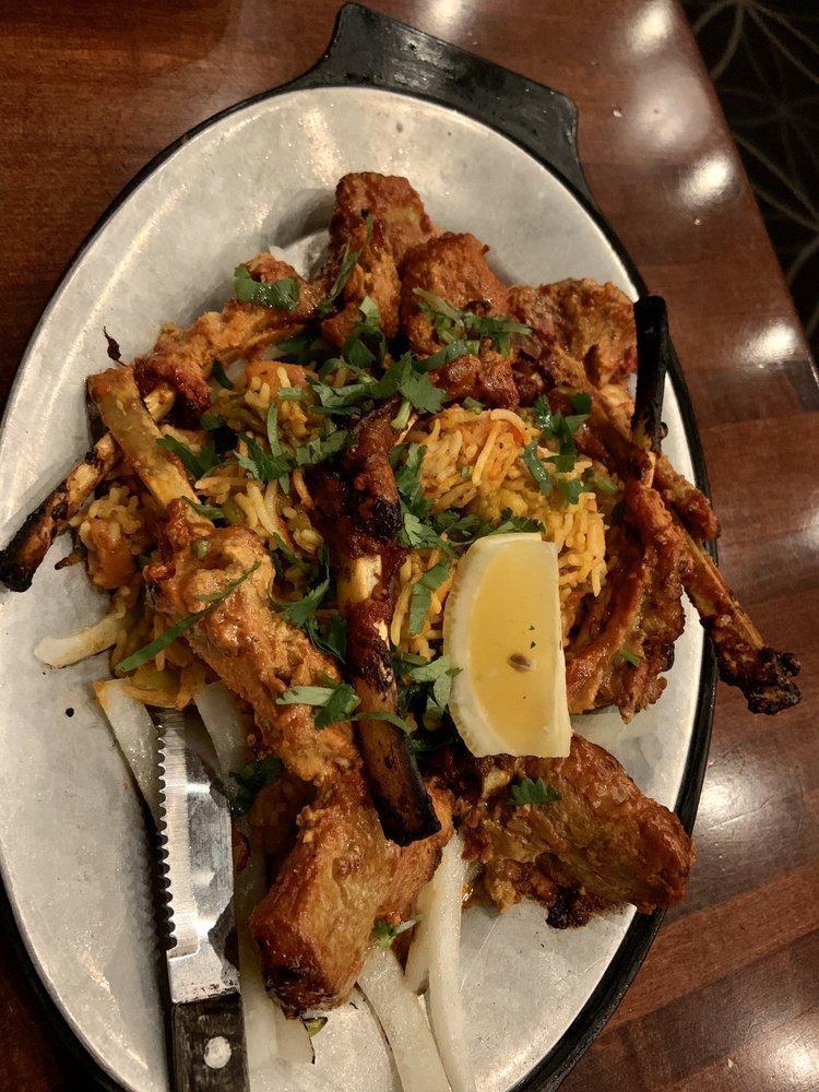 Lamb Chops · Succulent pieces of lamb chops marinated in spices, then broiled on skewers over charcoal in the tandoor. Served with biryani.