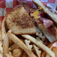 Grilled Cheese BLT · Sourdough bread, melted cheddar, bacon, lettuce, tomato and mayo served with fries.