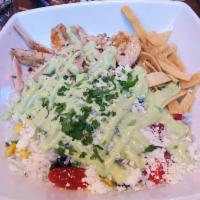 Southwest Chicken Bowl · Charred corn, black beans, queso fresco, teardrop tomatoes, crispy tortilla strips and avoca...