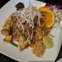 Pad Thai · Pan-fried rice noodles with egg, bean sprouts, scallions, tofu, and ground peanuts. Sauteed ...