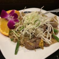 Drunken Noodles · Pad kee-mao. Pan-fried wide rice noodles with egg, green bean, bean sprouts, bell peppers, o...