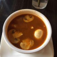 Tom Yum Soup · Thai style hot and sour soup with lemon grass, mushroom, lime juice, onion, bell pepper. Spi...