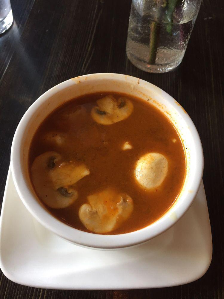 Tom Yum Soup · Thai style hot and sour soup with lemon grass, mushroom, lime juice, onion, bell pepper. Spicy.