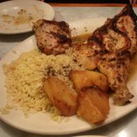 Greek Chicken · Half chicken broiled & seasoned with olive oil, lemon, oregano. Served with rice and oven br...