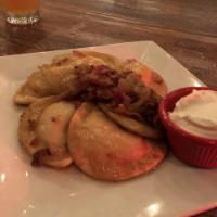 Pierogies · Locally made, potato and cheese, beer braised onions, bacon.
