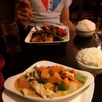 Massaman Curry · Massaman curry with coconut milk, sweet potatoes, onions, carrots, green peppers and roasted...