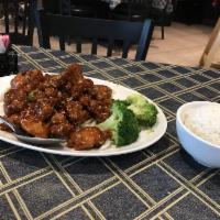 Sesame Chicken · Deep fried chunks of boneless chicken, sauteed in a spicy sauce and sprinkled with sesame se...