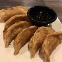 Chicken Pot Stickers · 6 pieces. Chicken and vegetable potstickers. Served with ginger soy vinaigrette.
