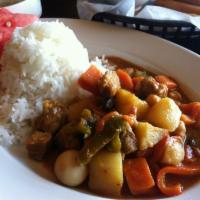 Menudo · Tomato based stew with a hint of sweetness served as small cuts of pork, potatoes, carrots, ...