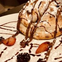 Nutella Calzone · Nutella, mixed berries, powdered sugar and balsamic glaze.