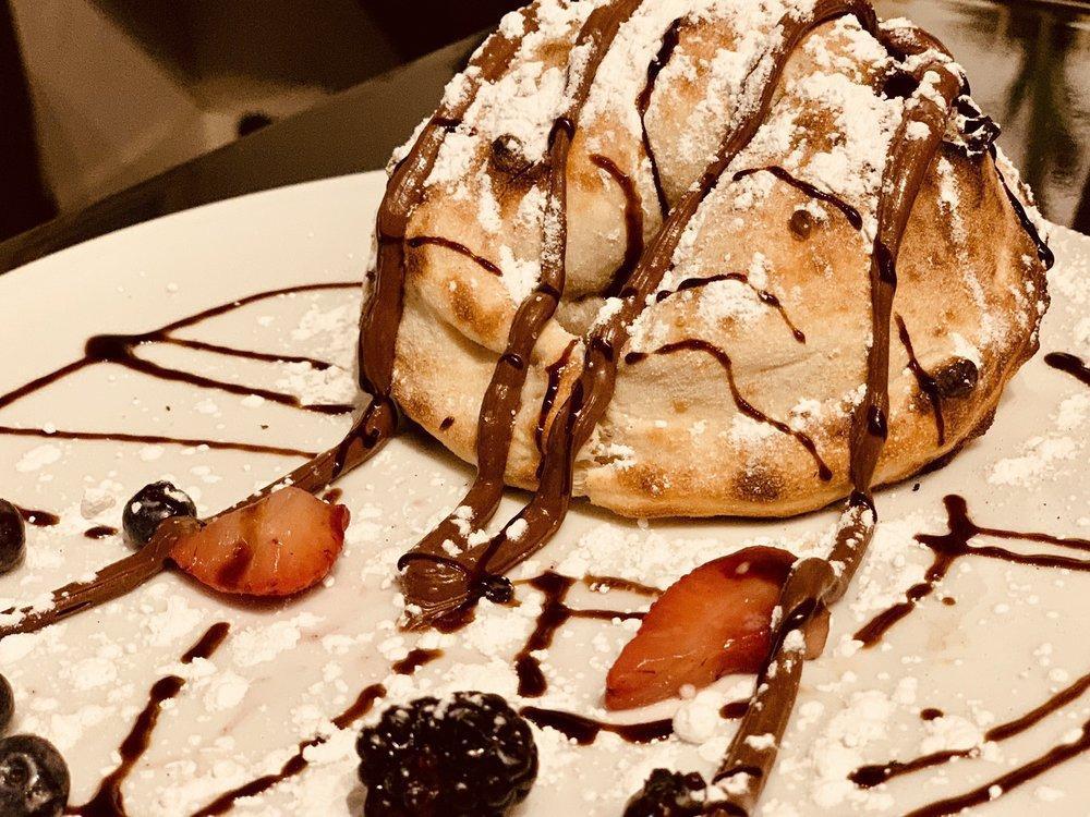 Nutella Calzone · Nutella, mixed berries, powdered sugar and balsamic glaze.
