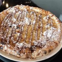 Nutella Pizza · Mascarpone base topped with Nutella and powdered sugar.