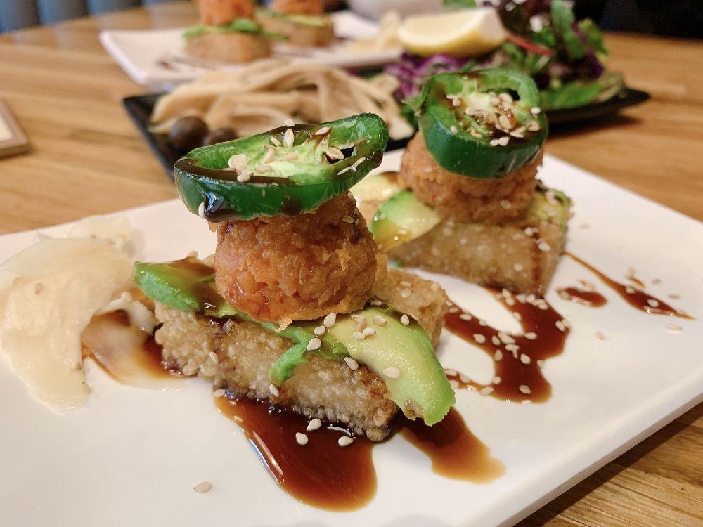Crispy Rice with Spicy Tuna · Spicy tuna, crispy rice, avocado, jalapeno, sesame seeds, and eel sauce with white ginger.