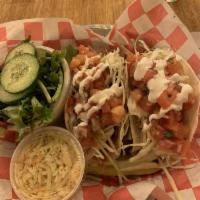 Fish Tacos · Pan seared grouper with pico de gallo, cabbage and sour cream on soft shell flour tortillas....