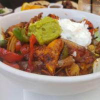 Fajita Salad · Bell pepper, onions, tomatoes, green squash, yellow squash and the choice of meat served ove...
