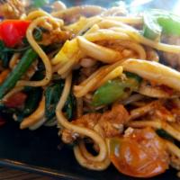 Spaghetti Kee Mao · Spaghetti sauteed with Thai style basil pesto sauce. 
