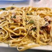 Seafood Pasta · Salmon, prawns, and mushrooms over a bed of fettuccine with your choice of Alfredo, marinara...