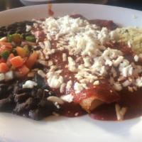 Tres Cheese Enchiladas · 2 enchiladas filled with mild Mexican cheeses with choice of black beans, cascabel or mole s...