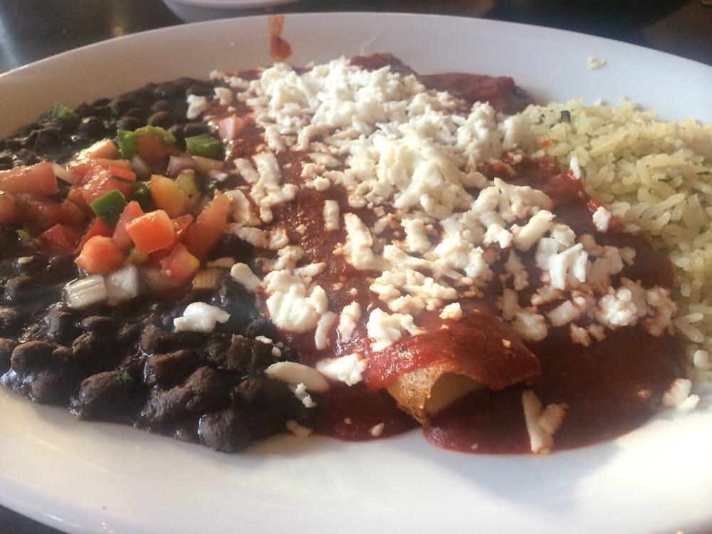 Tres Cheese Enchiladas · 2 enchiladas filled with mild Mexican cheeses with choice of black beans, cascabel or mole sauces and served with cilantro lime rice and black beans.