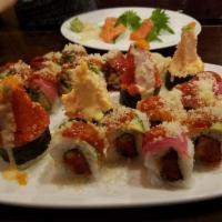 Crazy Couple Roll · Spicy crawfish & spicy tuna. Topped w/ salmon, escolar, avocado, sriracha sauce & tempura fl...