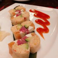 Summer Roll · Rice-less, rice paper wrapped tuna, salmon, snow crab, cream cheese & avocado. Topped w/ spi...
