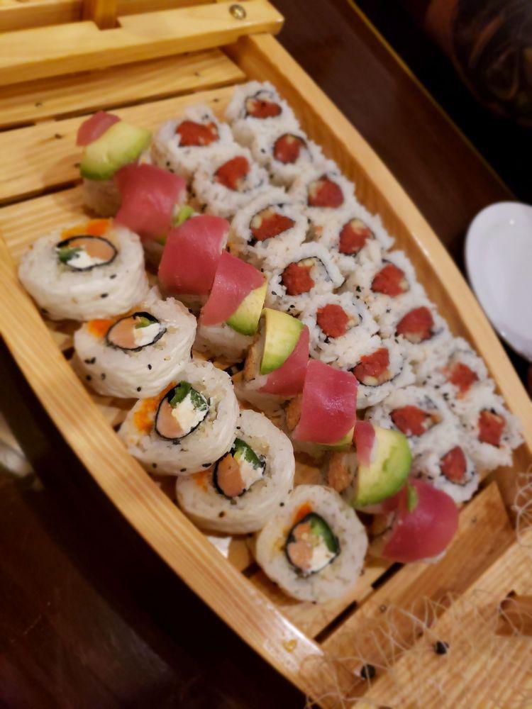 Sumo Roll · Shrimp tempura, avocado, snow crab, asparagus & masago. Wrapped in marbled nori & eel sauce.