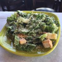 House Caesar Salad · Chopped romaine with croutons and Parmesan cheese tossed in a Caesar dressing.