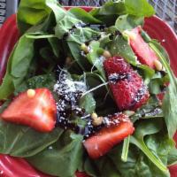 House Spinach Salad · Fresh spinach, strawberries, pine nuts, and Parmesan tossed in a cranberry balsamic dressing...