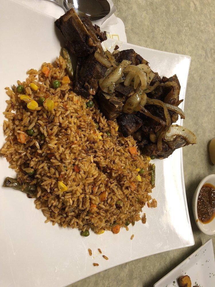 Jollof Rice · Rice cooked in a special stew with a combination of west African spices and herbs with mixed vegetables.