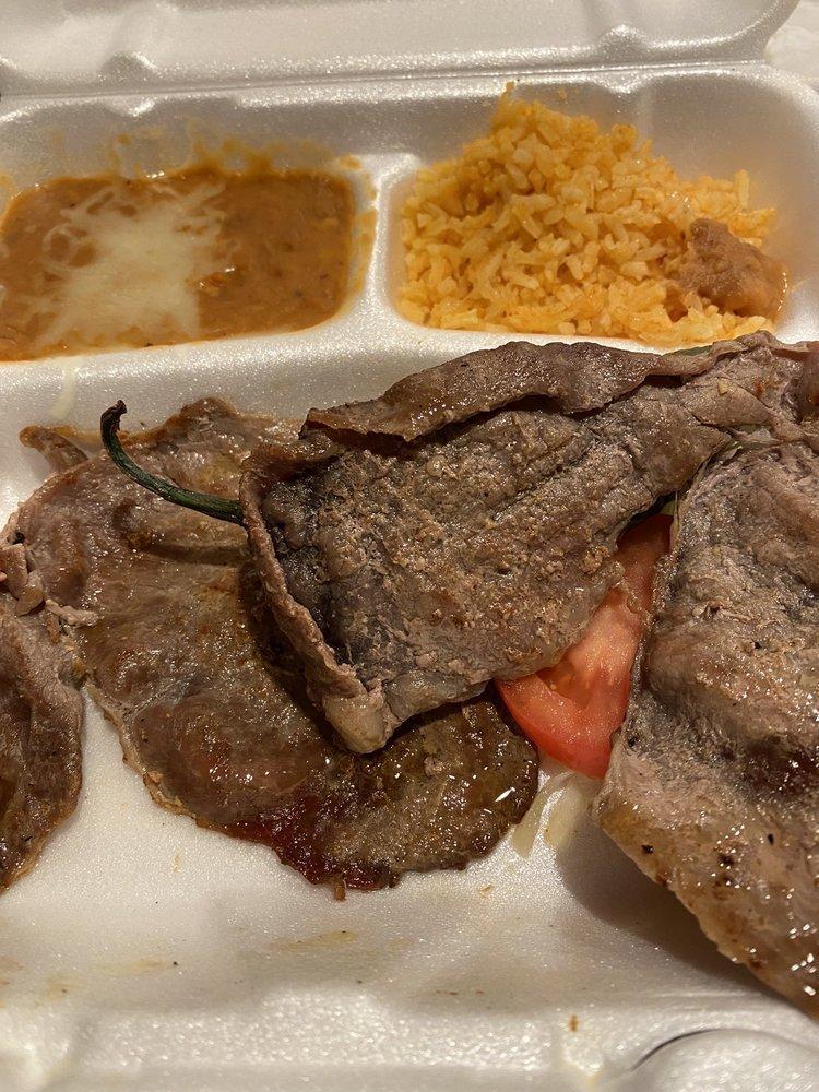 Carne Asada · Marinated thin sirloin steak, broiled to perfection and served with warm flour or corn tortillas. Includes rice and beans.
