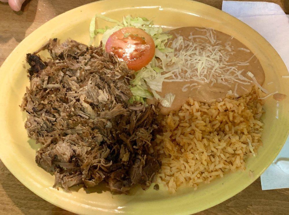 Carnitas Plate · Deep fried pork meat topped with onions, cilantro and served with flour or corn tortillas. Includes rice and beans.
