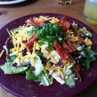 Chopped Chicken Salad · Roasted chicken breast chopped and tossed with fresh lettuce, diced tomatoes vinaigrette, to...