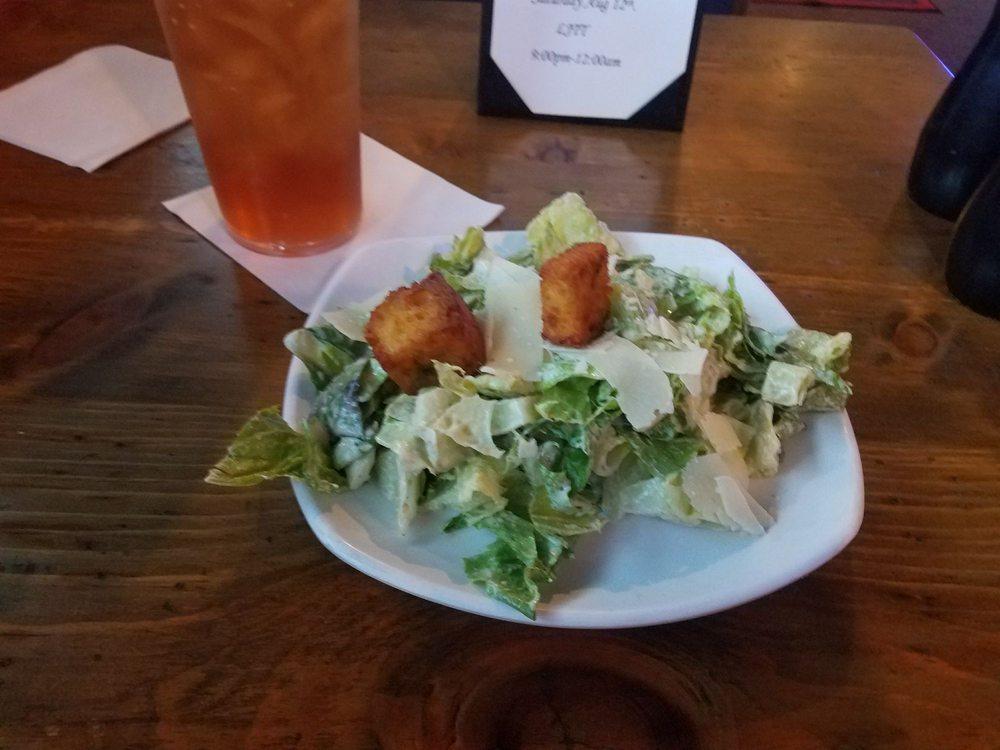 Caesar Salad · Fresh chopped romaine, tossed in Caesar dressing with jalapeno, corn bread croutons and Parmesan cheese.
