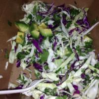 Cabbage Salad · Shredded cabbage tossed with lime juice, avocado, cilantro and homemade dressing. Vegetarian.