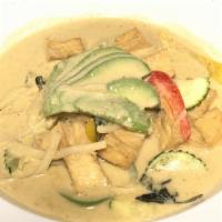 Green Curry · Green curry with coconut milk, bell peppers, zucchinis, bamboo shoots and basil leaves.