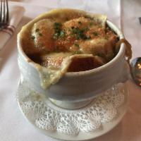 French Onion Soup · Caramelized onions, amontillado sherry and melting gruyere.