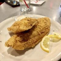 Catfish Dinner · Filet and a half, lighty dusted with Cajun seasonings and deep fried in peanut oil.