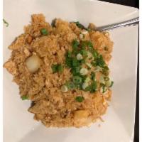 Pineapple Fried Rice · Fried rice with crab meat, shrimp, chicken, pineapple, onion, cashew nut and egg.