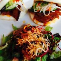 2 Spicy Pork Buns · Grilled spicy pork belly on sweet flour buns served with salad.