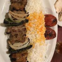 Shish Kabob · Charbroiled juicy chunks of marinated filet mignon skewered with onion and bell pepper , ser...