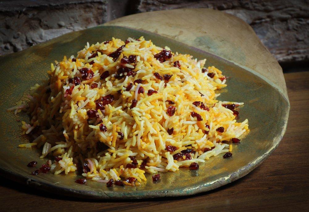 Zereshk Polo · A tantalizing taste of barberries and saffron in a mixture of basmati rice.
