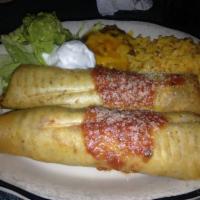 Flautas · Four crispy rolled corn tortillas with shredded beef or chicken, served with shredded lettuc...