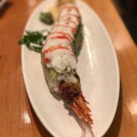 Dragon Roll · Tempura shrimp, avocado, fish egg, wrapped with white seaweed and topped with lobster tail. ...