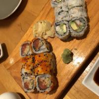 Spicy Crunch Tuna Roll · Spicy tuna, scallions, cucumber and tempura flakes covered with fish egg.