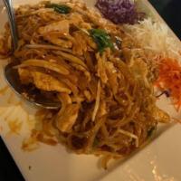 Pad Thai · Pan-fried rice noodles with eggs, bean sprouts, onions, crushed peanut, and your choice of m...