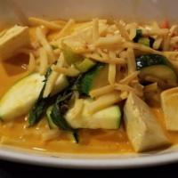 Red Curry · Hot and spicy red curry with bamboo shoots, zucchinis, bell peppers, basil leaves and your c...