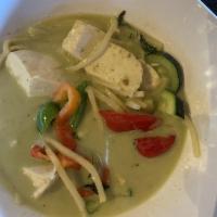 Green Curry · Green curry with bamboo shoots, bell peppers, zucchinis, basil leaves and your choice of mea...
