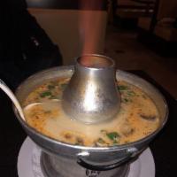 Tom Kha Kai · Chicken in a spicy soup containing an exotic lemongrass broth with coconut milk and mushroom...