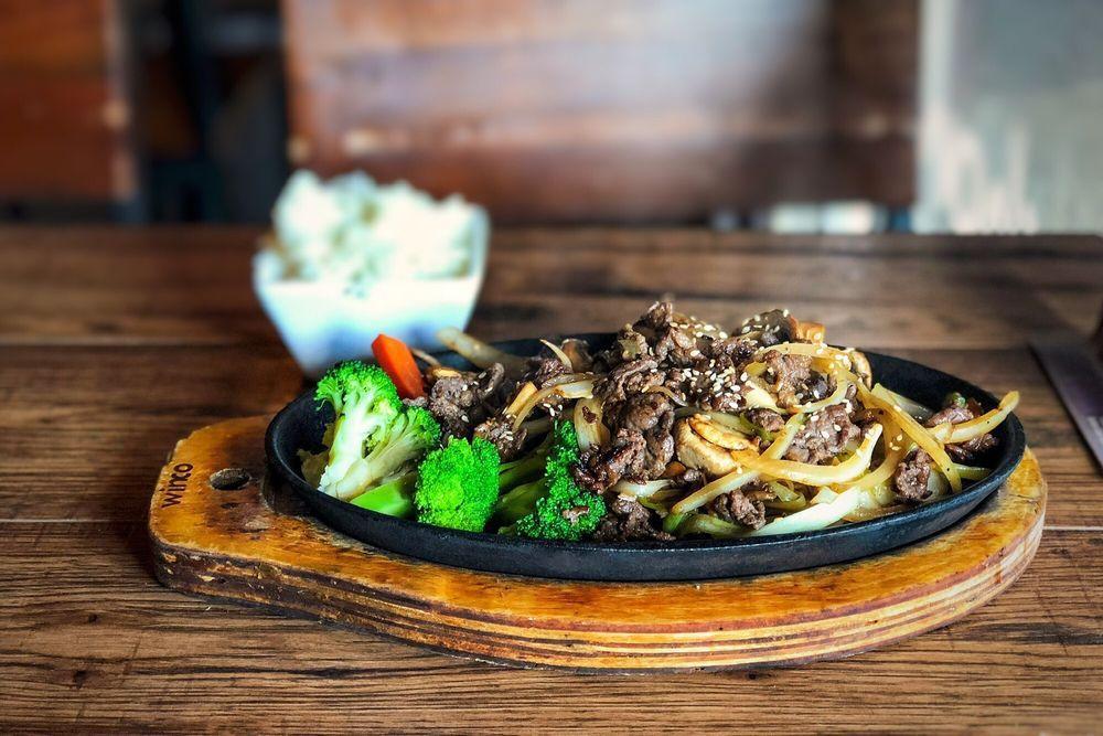 Bulgogi · Thinly sliced ribeye beef marinated with a homemade sauce, sauteed with mushrooms, scallions and onions. Served with white rice.